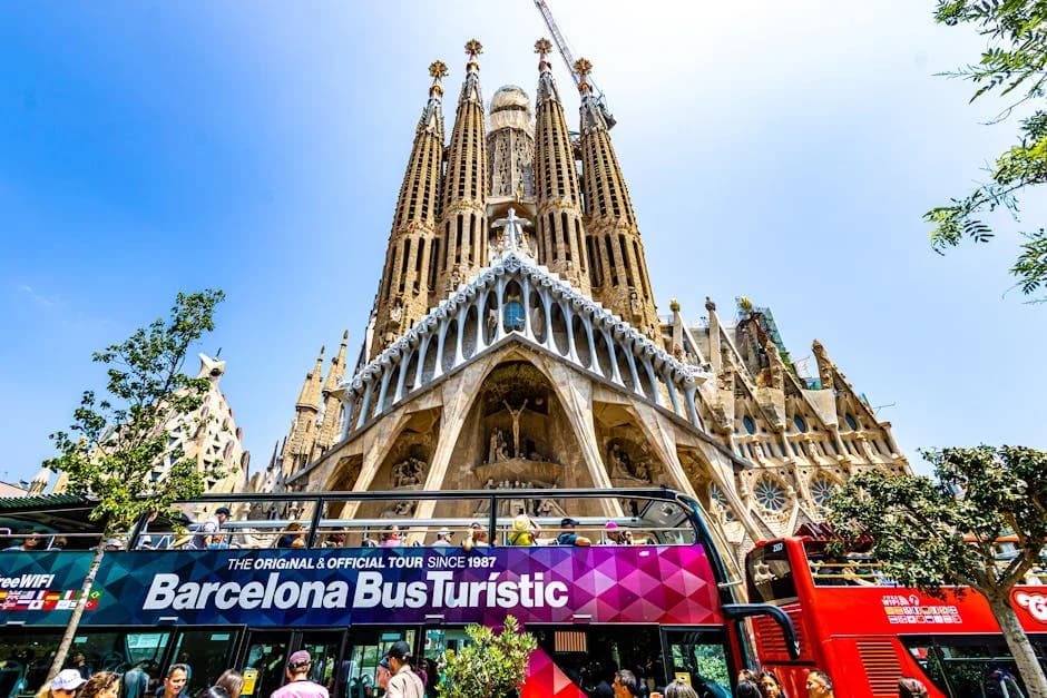 Vibrant scene of tourists at Sagrada Familia in Barcelona, Spain.